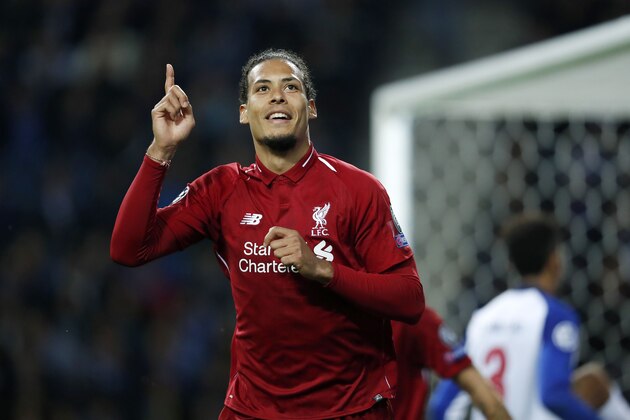 (L-R) Virgil van Dijk of Liverpool FC, Eder Militao of FC Porto during the UEFA Champions League quarter final match between FC Porto and Liverpool FC at Estadio do Dragao on April 17, 2019 in Porto, Portugal(Photo by VI Images via Getty Images)
