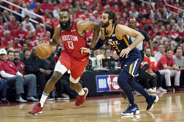 Houston Rockets guard James Harden (13) drives against Utah Jazz's Ricky Rubio (3) during the first half of Game 2 of a first-round NBA basketball playoff series in Houston, Wednesday, April 17, 2019. (AP Photo/David J. Phillip)
