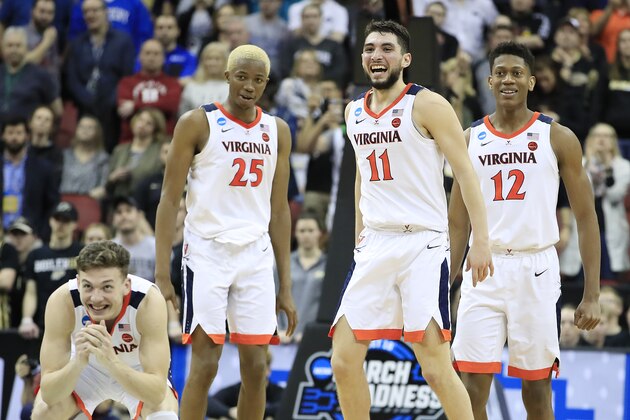 LOUISVILLE, KENTUCKY - MARCH 30:  Ty Jerome #11, Kyle Guy #5, Mamadi Diakite #25, and De'Andre Hunter #12 of the Virginia Cavaliers celebrate during overtime of the 2019 NCAA Men's Basketball Tournament South Regional at KFC YUM! Center on March 30, 2019 in Louisville, Kentucky. (Photo by Andy Lyons/Getty Images)