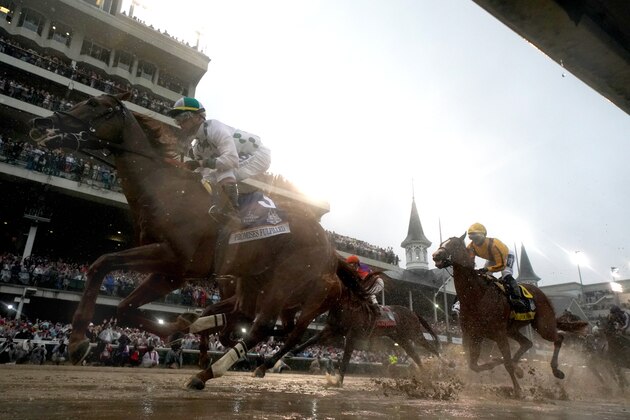 LOUISVILLE, KY - MAY 05:  Promises Fulfilled #3, ridden by jockey Corey Lanerie leads the field into the first turn during the 144th running of the Kentucky Derby at Churchill Downs on May 5, 2018 in Louisville, Kentucky.  (Photo by Rob Carr/Getty Images)