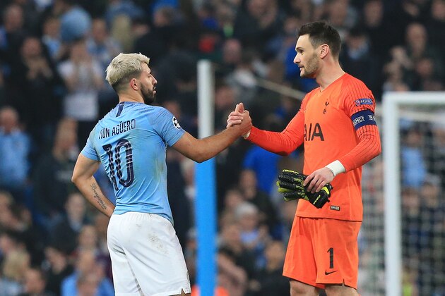 Manchester City's Argentinian striker Sergio Aguero (L) congratulates Tottenham Hotspur's French goalkeeper Hugo Lloris following the UEFA Champions League quarter final second leg football match between Manchester City and Tottenham Hotspur at the Etihad Stadium in Manchester, north west England on April 17, 2019. - The match ended 4-4, but Tottenham progress to the semi finals on goal difference. (Photo by Lindsey PARNABY / AFP)        (Photo credit should read LINDSEY PARNABY/AFP/Getty Images)