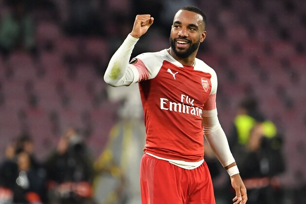 Arsenal's French striker Alexandre Lacazette celebrates after opening the scoring during the UEFA Europa League quarter-final second leg football match Napoli vs Arsenal on April 18, 2019 at the San Paolo stadium in Naples. (Photo by Andreas SOLARO / AFP)        (Photo credit should read ANDREAS SOLARO/AFP/Getty Images)