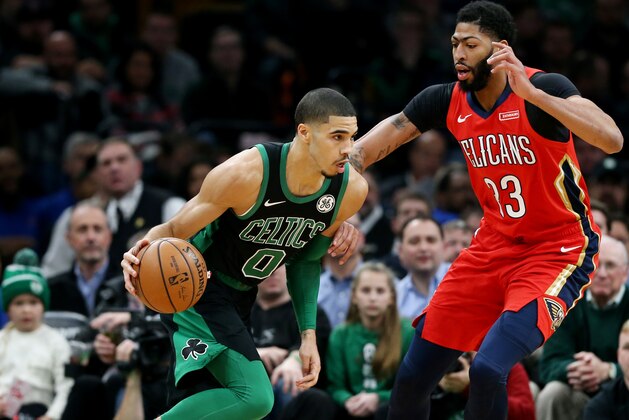 BOSTON, MA - DECEMBER 10: Jayson Tatum #0 of the Boston Celtics drives against Anthony Davis #23 of the New Orleans Pelicans at TD Garden on December 10, 2018 in Boston, Massachusetts. (Photo by Maddie Meyer/Getty Images)