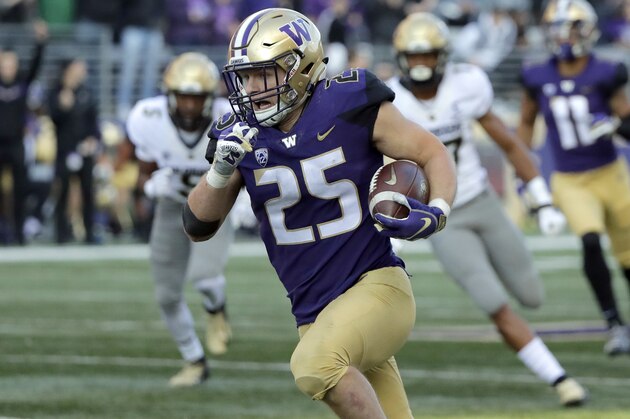 Washington linebacker Ben Burr-Kirven (25) runs after he intercepted a pass thrown by Colorado quarterback Steven Montez during the second half of an NCAA college football game, Saturday, Oct. 20, 2018, in Seattle. Washington won 27-13. (AP Photo/Ted S. Warren)