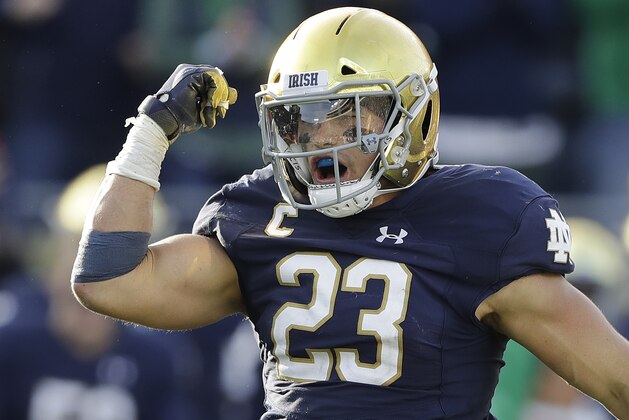 File-This Oct. 13, 2018, file photo shows Notre Dame linebacker Drue Tranquill celebrating after making a tackle during the second half of an NCAA college football game against Pittsburgh. Notre Dame defensive captain Tranquill and leading receiver Miles Boykin weren’t even Fighting Irish fans the last time they had a 12-0 regular season. Maybe that was a good thing since those current players didn’t have to suffer through how that season ended. (AP Photo/Darron Cummings, File)