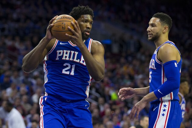 PHILADELPHIA, PA - APRIL 15: Joel Embiid #21 of the Philadelphia 76ers grabs a rebound in front of Ben Simmons #25 against the Brooklyn Nets in Game Two of Round One of the 2019 NBA Playoffs at the Wells Fargo Center on April 15, 2019 in Philadelphia, Pennsylvania. NOTE TO USER: User expressly acknowledges and agrees that, by downloading and or using this photograph, User is consenting to the terms and conditions of the Getty Images License Agreement. (Photo by Mitchell Leff/Getty Images)