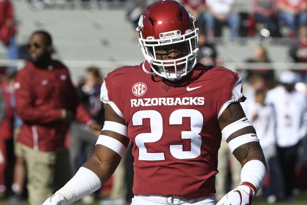 Arkansas defensive back Dre Greenlaw warms up before playing Tulsa in an NCAA college football game Saturday, Oct. 20, 2018, in Fayetteville, Ark. (AP Photo/Michael Woods)