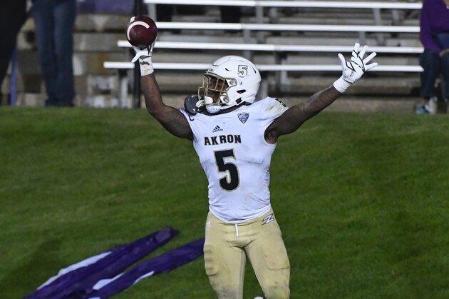 Akron linebacker Ulysees Gilbert III (5) celebrates after he picks up a loose ball for a touchdown against Northwestern during the second half of an NCAA college football game in Evanston, Ill., Saturday, Sept. 15, 2018. (AP Photo/Matt Marton)