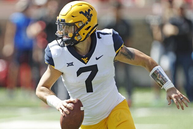 FILE - In this Sept. 29, 2018, file photo, West Virginia's Will Grier (7) looks to pass the ball during the second half of an NCAA college football game against Texas Tech, in Lubbock, Texas. Grier is looking forward to picking up where he left off against No. 15 Texas. Grier broke the middle finger on his throwing hand a year ago when he dove for the end zone pylon in the first quarter of West Virginia's 28-14 loss to the Longhorns. (AP Photo/Brad Tollefson, File)