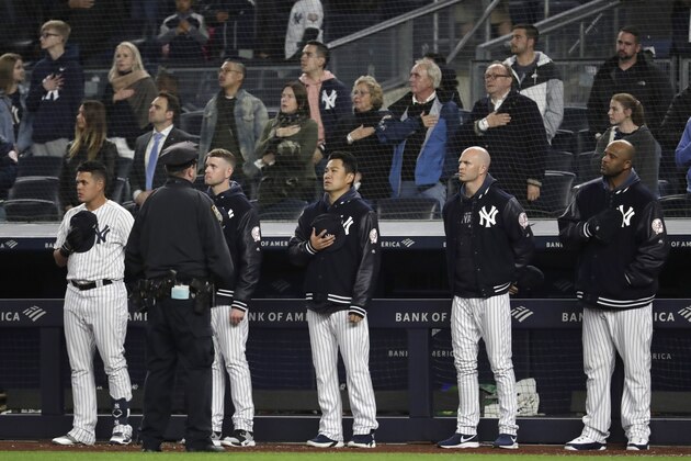 New York Yankees players listen to