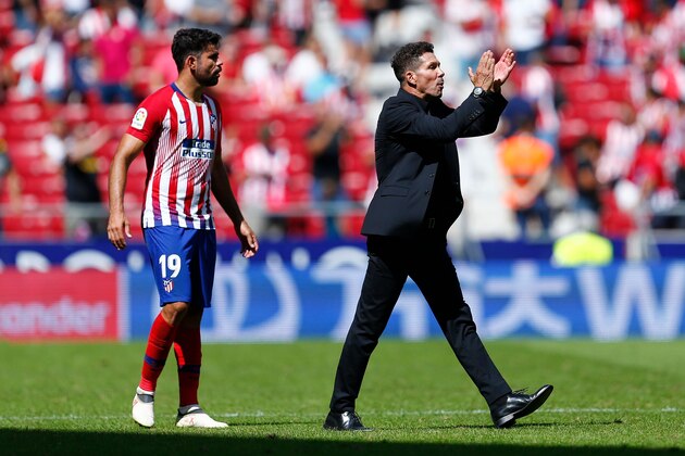 Atletico Madrid's Argentinian coach Diego Simeone (R) applauds next to Atletico Madrid's Spanish forward Diego Costa during the Spanish league football match between Club Atletico de Madrid and Eibar at the Wanda Metropolitan stadium in Madrid on September 15, 2018. (Photo by Benjamin CREMEL / AFP)        (Photo credit should read BENJAMIN CREMEL/AFP/Getty Images)