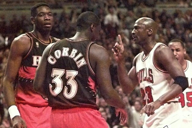 CHICAGO, UNITED STATES:  Michael Jordan (R) of the Chicago Bulls gets a techincal foul for waving his finger at Dikembe Mutombo (L) and Tyrone Corbin (C) of the Atlanta Hawks 13 May during the first half of game five of their Eastern Conferecne Semifinals game at the United Center in Chicago Illinois. (ELECTRONIC IMAGE) AFP PHOTO  Jeff HAYNES (Photo credit should read JEFF HAYNES/AFP/Getty Images)