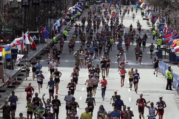 Runners race to the finish line in the 123rd Boston Marathon on Monday, April 15, 2019, in Boston. (AP Photo/Charles Krupa)