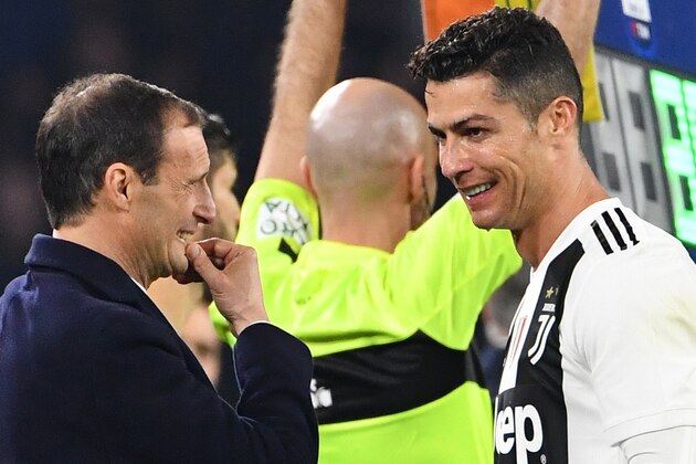 Juventus' Italian coach Massimiliano Allegri (L) speaks with Juventus' Portuguese forward Cristiano Ronaldo during the Italian Serie A football match between Napoli and Juventus on March 3, 2019, at the San Paolo Stadium in Naples. (Photo by Alberto PIZZOLI / AFP)        (Photo credit should read ALBERTO PIZZOLI/AFP/Getty Images)