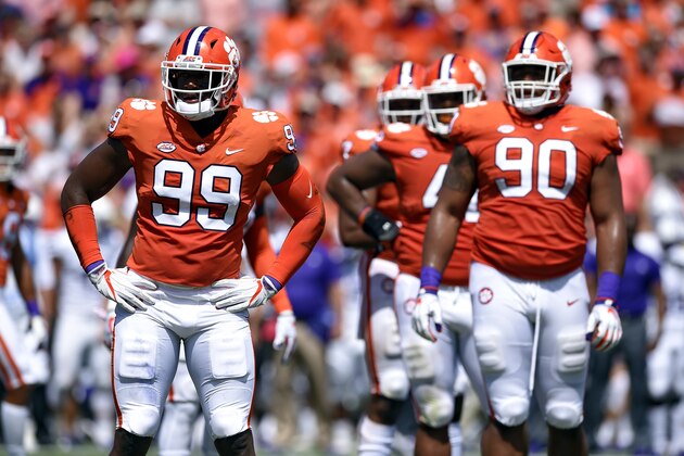 Clemson defenders Clelin Ferrell (99) and Dexter Lawrence (90) look to the bench for the play during the first half of an NCAA college football game against Furman Saturday, Sept. 1, 2018, in Clemson, S.C. Clemson won 48-7. (AP Photo/Richard Shiro)