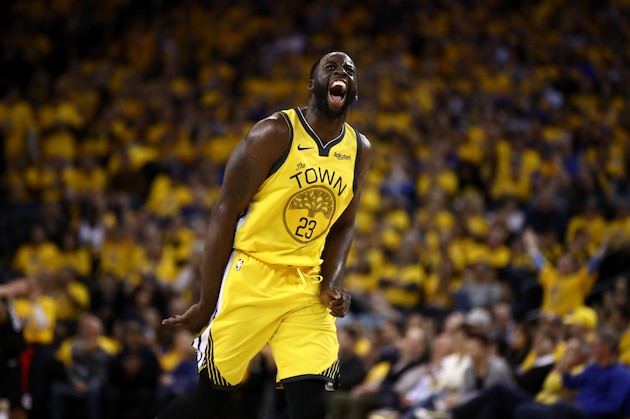 OAKLAND, CALIFORNIA - APRIL 15:  Draymond Green #23 of the Golden State Warriors reacts after he made a basket against the LA Clippers during Game Two of the first round of the 2019 NBA Western Conference Playoffs at ORACLE Arena on April 15, 2019 in Oakland, California.  NOTE TO USER: User expressly acknowledges and agrees that, by downloading and or using this photograph, User is consenting to the terms and conditions of the Getty Images License Agreement.  (Photo by Ezra Shaw/Getty Images)