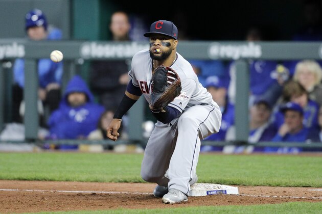 Cleveland Indians first baseman Carlos Santana waits for the throw for an inning-ending out on a hit by Kansas City Royals' Chris Owings at Kauffman Stadium in Kansas City, Mo., Saturday, April 13, 2019. (AP Photo/Colin E. Braley)