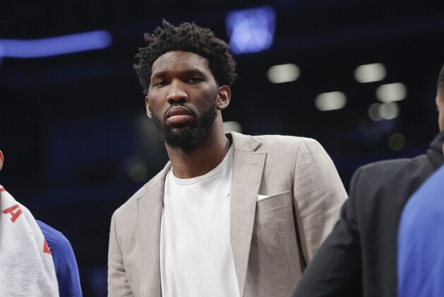 Philadelphia 76ers' Joel Embiid watches during the first half in Game 3 of the team's first-round NBA basketball playoff series against the Brooklyn Nets on Thursday, April 18, 2019, in New York. (AP Photo/Frank Franklin II)