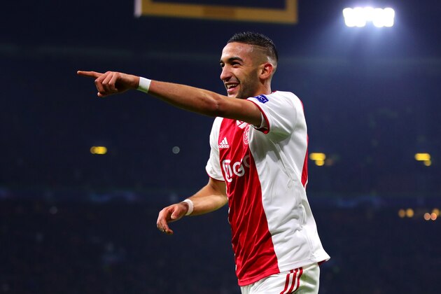 AMSTERDAM, NETHERLANDS - FEBRUARY 13: Hakim Ziyech of Ajax celebrates scoring his sides first goal during the UEFA Champions League Round of 16 First Leg match between Ajax and Real Madrid at Johan Cruyff Arena on February 13, 2019 in Amsterdam, . (Photo by Chris Brunskill/Fantasista/Getty Images)