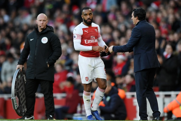 LONDON, ENGLAND - DECEMBER 22: Alexandre Lacazette of Arsenal speaks to Unai Emery, Manager of Arsenal during the Premier League match between Arsenal FC and Burnley FC at Emirates Stadium on December 22, 2018 in London, United Kingdom.  (Photo by Shaun Botterill/Getty Images)