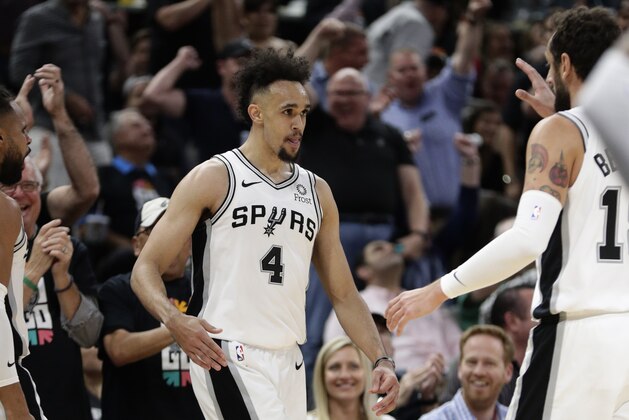 San Antonio Spurs guard Derrick White (4) celebrates a score against the Denver Nuggets with teammates during the first half of Game 3 of an NBA basketball playoff series in San Antonio, Thursday, April 18, 2019. San Antonio won 118-108. (AP Photo/Eric Gay)