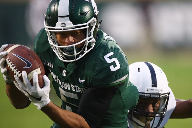 EAST LANSING, MI - NOVEMBER 04: Hunter Rison #5 of the Michigan State Spartans makes a second half catch while playing the Penn State Nittany Lions at Spartan Stadium on November 4, 2017 in East Lansing, Michigan. Michigan State won the game 27-24. (Photo by Gregory Shamus/Getty Images)