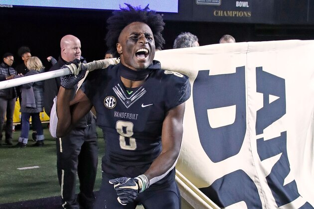 NASHVILLE, TN - NOVEMBER 24:  Joejuan Williams #8 of the Vanderbilt Commodores carries an Anchor Down flag after a 38-13 Vanderbilt victory over the Tennessee Volunteers at Vanderbilt Stadium on November 24, 2018 in Nashville, Tennessee.  (Photo by Frederick Breedon/Getty Images)