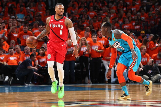 OKLAHOMA CITY, OK - APRIL 19: Damian Lillard #0 of the Portland Trail Blazers handles the ball against Dennis Schroder #17 of the Oklahoma City Thunder during Round One Game Three of the 2019 NBA Playoffs on April 19, 2019 at Chesapeake Energy Arena in Oklahoma City, Oklahoma. NOTE TO USER: User expressly acknowledges and agrees that, by downloading and or using this photograph, User is consenting to the terms and conditions of the Getty Images License Agreement. Mandatory Copyright Notice: Copyright 2019 NBAE (Photo by Zach Beeker/NBAE via Getty Images)