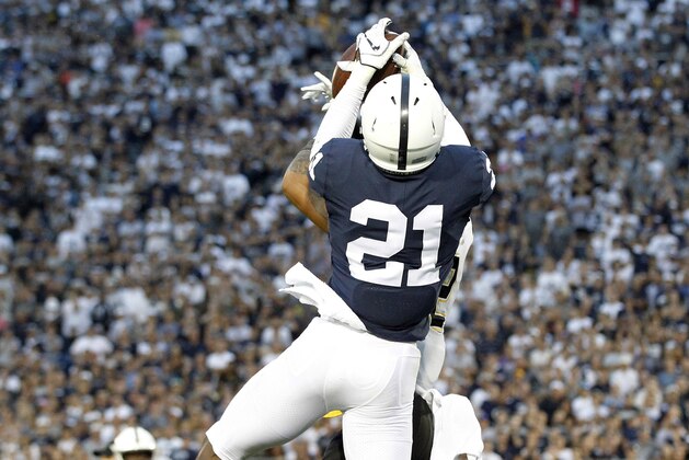 Penn State's Amani Oruwariye (21) intercepts a pass intended for Appalachian State's Corey Sutton (2) in the end zone during overtime of an NCAA college football game in State College, Pa., Saturday, Sept. 1, 2018. Penn State won 45-38 in OT. (AP Photo/Chris Knight)