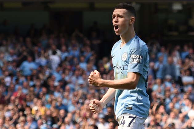 Manchester City's English midfielder Phil Foden celebrates scoring the opening goal during the English Premier League football match between Manchester City and Tottenham Hotspur at the Etihad Stadium in Manchester, north west England, on April 20, 2019. (Photo by Oli SCARFF / AFP) / RESTRICTED TO EDITORIAL USE. No use with unauthorized audio, video, data, fixture lists, club/league logos or 'live' services. Online in-match use limited to 120 images. An additional 40 images may be used in extra time. No video emulation. Social media in-match use limited to 120 images. An additional 40 images may be used in extra time. No use in betting publications, games or single club/league/player publications. /         (Photo credit should read OLI SCARFF/AFP/Getty Images)
