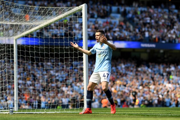 MANCHESTER, ENGLAND - APRIL 20:   Phil Foden of Manchester City celebrates after scoring his team's first goal during the Premier League match between Manchester City and Tottenham Hotspur at Etihad Stadium on April 20, 2019 in Manchester, United Kingdom. (Photo by Shaun Botterill/Getty Images)