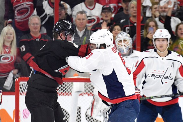 RALEIGH, NORTH CAROLINA - APRIL 15: Alex Ovechkin #8 of the Washington Capitals knocks out Andrei Svechnikov #37 of the Carolina Hurricanes as they fight during the first period in Game Three of the Eastern Conference First Round during the 2019 NHL Stanley Cup Playoffs at PNC Arena on April 15, 2019 in Raleigh, North Carolina. (Photo by Grant Halverson/Getty Images)