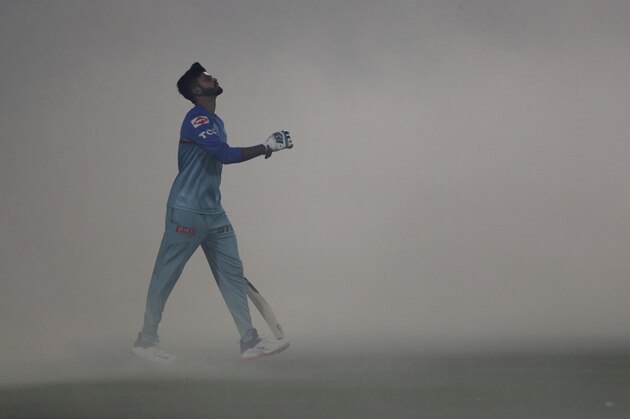 Delhi Capitals captain Shreyas Iyer walks for practice into the ground  covered with fumigation smoke, ahead of VIVO IPL cricket T20 match against Sunrisers Hyderabad in New Delhi, India, Thursday, April 4, 2019. (AP Photo/Altaf Qadri)
