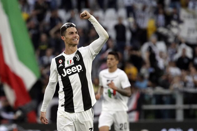 Juventus' Cristiano Ronaldo celebrates at the end of a Serie A soccer match between Juventus and AC Fiorentina, at the Allianz stadium in Turin, Italy, Saturday, April 20, 2019. Juventus clinched a record-extending eighth successive Serie A title, with five matches to spare, after it defeated Fiorentina 2-1. (AP Photo/Luca Bruno)