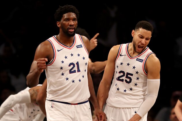 NEW YORK, NEW YORK - APRIL 20:  Joel Embiid #21 and Ben Simmons #25 of the Philadelphia 76ers celebrate the win over the Brooklyn Nets at Barclays Center on April 20, 2019 in the Brooklyn borough of New York City.The Philadelphia 76ers defeated the Brooklyn Nets 112-108. NOTE TO USER: User expressly acknowledges and agrees that, by downloading and or using this photograph, User is consenting to the terms and conditions of the Getty Images License Agreement. (Photo by Elsa/Getty Images)