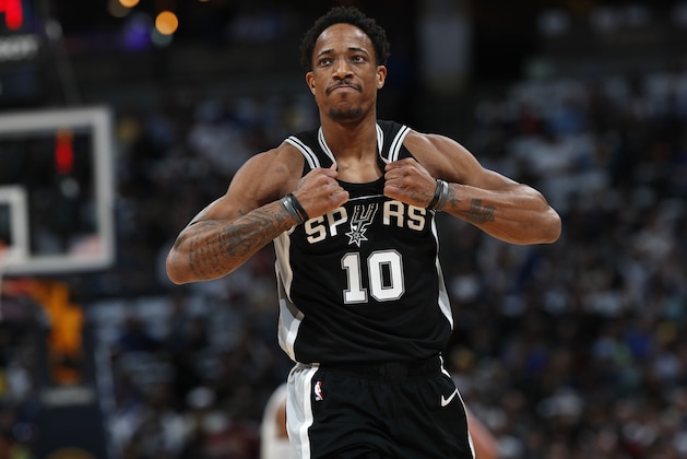 San Antonio Spurs guard DeMar DeRozan rips his jersey as he heads to the bench after drawing his second personal foul against the Denver Nuggets early in the first half of Game 2 of an NBA basketball playoff series Tuesday, April 16, 2019, in Denver. (AP Photo/David Zalubowski)