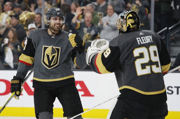 Vegas Golden Knights right wing Alex Tuch, left, celebrates with goalie Marc-Andre Fleury after scoring against the San Jose Sharks during the third period of Game 4 of a first-round NHL hockey playoff series Tuesday, April 16, 2019, in Las Vegas. (AP Photo/John Locher)