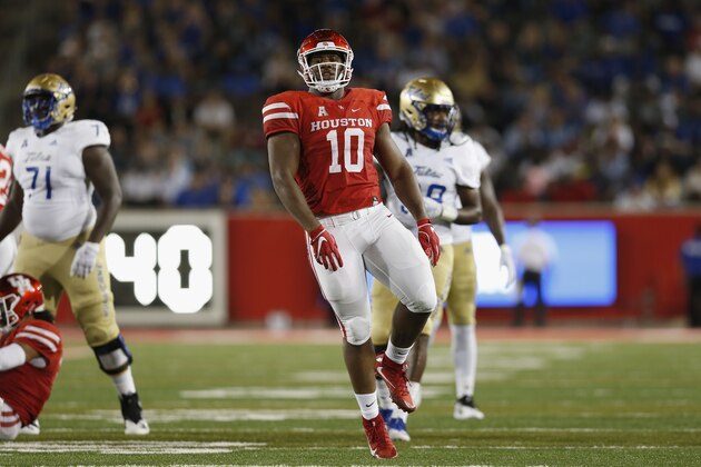 HOUSTON, TX - OCTOBER 04:  Ed Oliver #10 of the Houston Cougars celebrates after a tackle in the first half against the Tulsa Golden Hurricane at TDECU Stadium on October 4, 2018 in Houston, Texas.  (Photo by Tim Warner/Getty Images)