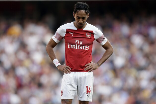 Arsenal's Pierre-Emerick Aubameyang reacts during the English Premier League soccer match between Arsenal and Crystal Palace at the Emirates Stadium in London, Sunday, April 21, 2019. (AP Photo/Tim Ireland)