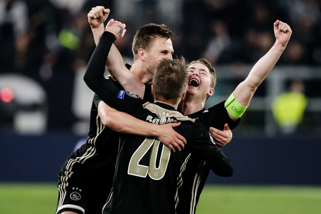 TURIN, ITALY - APRIL 16: Joel Veltman of Ajax of Ajax celebrate the victory with Lasse Schone of Ajax, Matthijs de Ligt of Ajax during the UEFA Champions League  match between Juventus v Ajax at the Allianz Stadium on April 16, 2019 in Turin Italy (Photo by Erwin Spek/Soccrates/Getty Images)
