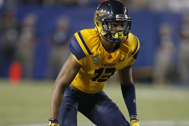 PROVO, UT - SEPTEMBER 30: Kadar Hollman #13 of the Toledo Rockets guards a Brigham Young Cougars player during the first half at a college football game at Lavell Edwards Stadium on September 30, 2016  in Provo, Utah. (Photo by George Frey/Getty Images)