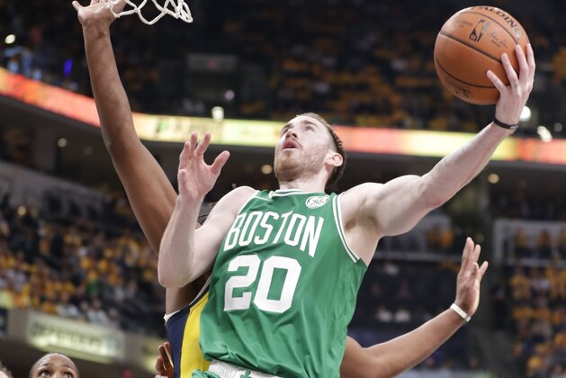 Boston Celtics forward Gordon Hayward (20) drives past Indiana Pacers center Myles Turner (33) during the first half of Game 4 of an NBA basketball first-round playoff series in Indianapolis, Sunday, April 21, 2019. (AP Photo/Michael Conroy)