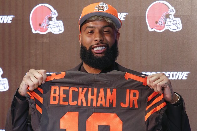 Cleveland Browns' Odell Beckham poses with his jersey during a news conference Monday, April 1, 2019, in Berea, Ohio. (AP Photo/Ron Schwane)