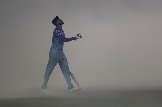 Delhi Capitals captain Shreyas Iyer walks for practice into the ground  covered with fumigation smoke, ahead of VIVO IPL cricket T20 match against Sunrisers Hyderabad in New Delhi, India, Thursday, April 4, 2019. (AP Photo/Altaf Qadri)