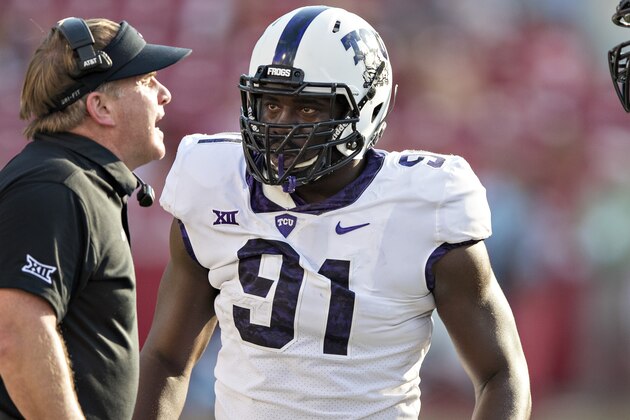 FAYETTEVILLE, AR - SEPTEMBER 9:  Head Coach Gary Patterson gives instructions to L.J. Collier #91 and Chris Bradley #56 of the TCU Horned Frogs during a game against the Arkansas Razorbacks at Donald W. Reynolds Razorback Stadium on September 9, 2017 in Fayetteville, Arkansas.  The Horn Frogs defeated the Razorbacks 28-7.  (Photo by Wesley Hitt/Getty Images)