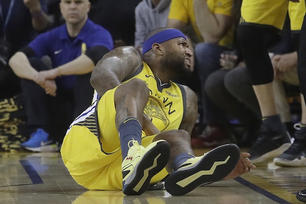 Golden State Warriors center DeMarcus Cousins reacts after falling to the floor during the first half of Game 2 of a first-round NBA basketball playoff series against the Los Angeles Clippers in Oakland, Calif., Monday, April 15, 2019. (AP Photo/Jeff Chiu)