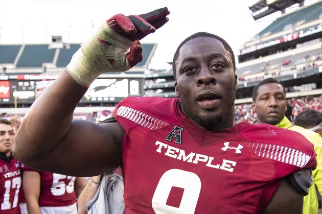 Temple's defensive tackle Michael Dogbe (9) celebrates with teammates following their 24-17 win in overtime against Cincinnati in an NCAA college football against Cincinnati, Saturday, Oct. 20, 2018, in Philadelphia. (AP Photo/Chris Szagola)