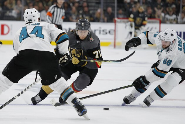 Vegas Golden Knights center William Karlsson (71) skates between San Jose Sharks defenseman Marc-Edouard Vlasic, left, and center Melker Karlsson during the second period in Game 6 of a first-round NHL hockey playoff series Sunday, April 21, 2019, in Las Vegas. (AP Photo/John Locher)