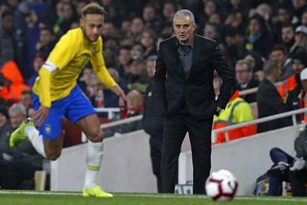 Brazil's head coach Tite watches from the touchline as Brazil's striker Neymar chases the ball during the international friendly football match between Brazil and Uruguay at The Emirates Stadium in London on November 16, 2018. (Photo by Adrian DENNIS / AFP)        (Photo credit should read ADRIAN DENNIS/AFP/Getty Images)