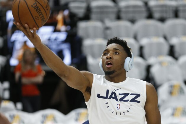 Utah Jazz guard Donovan Mitchell lays the ball up during practice before the start of Game 4 of a first-round NBA basketball playoff series against the Houston Rockets Monday, April 22, 2019, in Salt Lake City. (AP Photo/Rick Bowmer)
